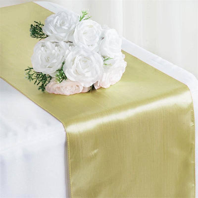 Gold satin table runner with white rose bouquet
