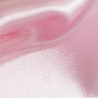 Pink satin fabric with a smooth, glossy texture.