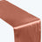 Rose gold satin table runner on a plain background.