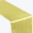 Yellow satin table runner on white backdrop