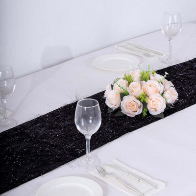 Elegant table setting with a floral centerpiece and glassware.