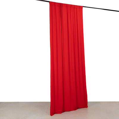 Red curtain draped on a rod against a plain background.