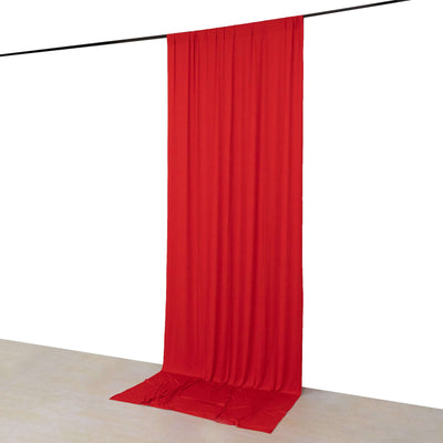 Red fabric backdrop draped from a rod, ideal for photography and events.