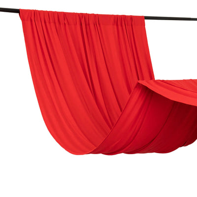 Red fabric draped elegantly on a black rod, showcasing its smooth texture.