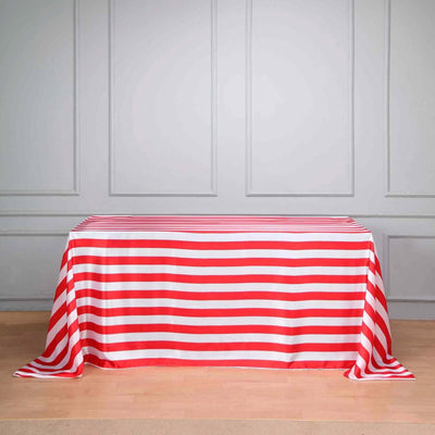 Red and white striped tablecloth on a wooden table.