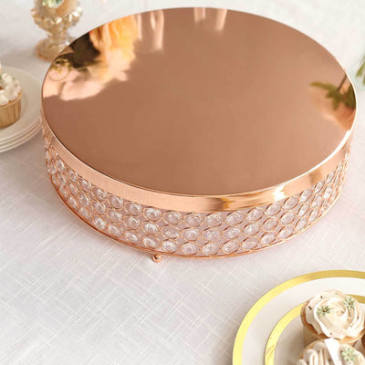 Rose gold cake stand with crystal accents, perfect for elegant desserts.