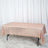 Rose gold sequin tablecloth on a table against a white backdrop.