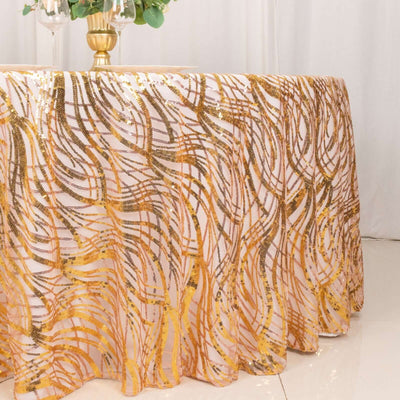 Gold sequin tablecloth with wavy design on a elegantly set table.