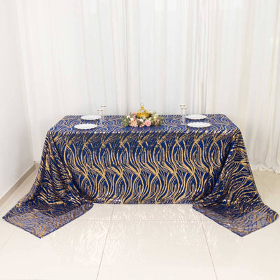 Elegant navy and gold tablecloth on a decorated dining table.