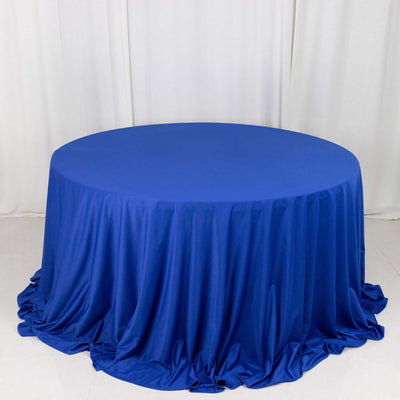 Round blue tablecloth draped elegantly on a circular table.