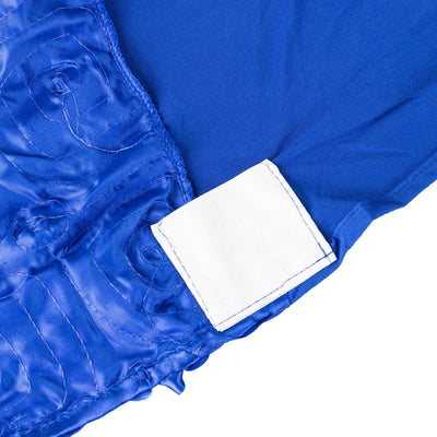 Blue fabric with textured design and white label tag.