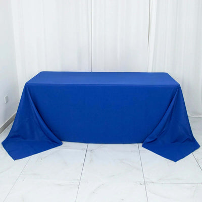 Blue tablecloth draped over a table on a white background.