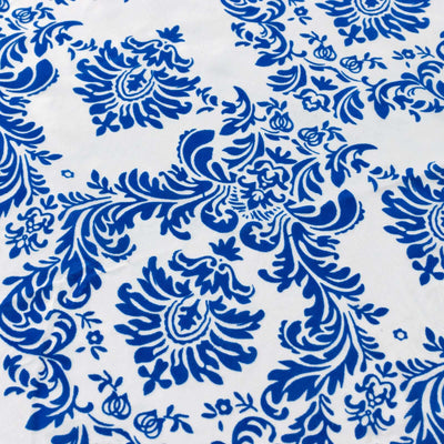 Blue floral pattern design on white fabric.