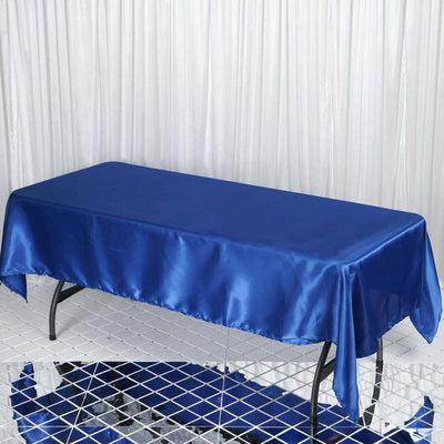 Blue satin tablecloth draped over a rectangular table