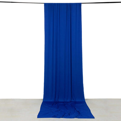 Blue fabric backdrop draped elegantly on the floor and hanging from a rod.
