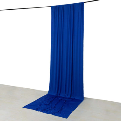 Blue fabric backdrop draped on a rod for photography or staging purposes