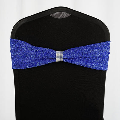 Blue sparkly chair sash with rhinestone accent on black chair.