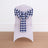 Chair with a blue and white checkered bow on a plain backdrop