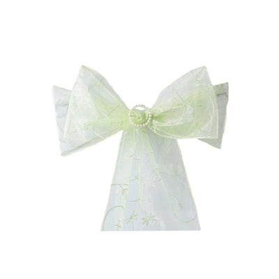 Green sheer decorative bow with pearl embellishment