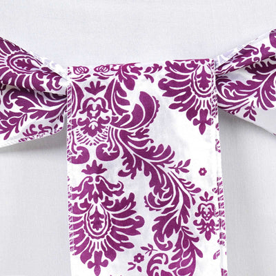 Purple damask bow tie on a white backdrop