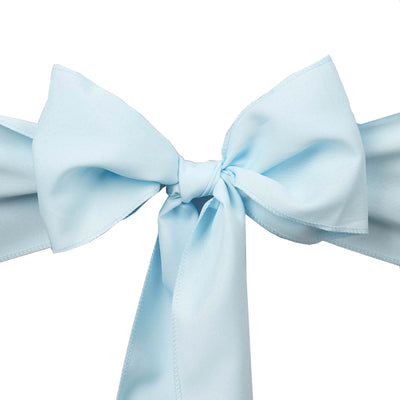 Light blue satin bow on a plain background