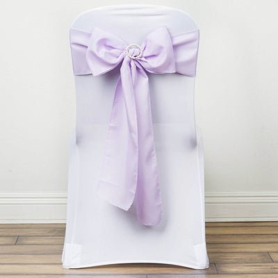Purple satin chair bow on a white chair cover.