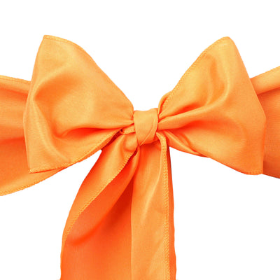 Orange satin bow with tails, perfect for gifts or decorations.