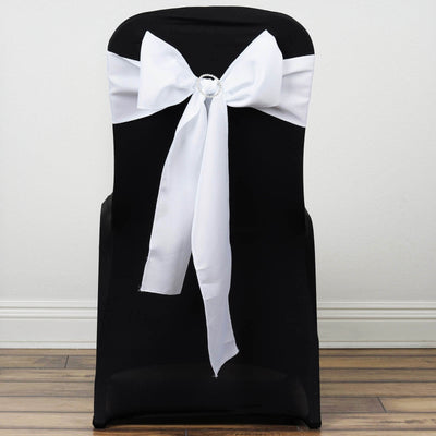Black chair cover with white bow decoration for events and weddings.