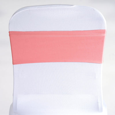 White chair cover with a coral sash