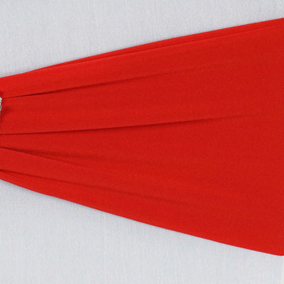 Red flowing dress with a flattering silhouette on a neutral background.