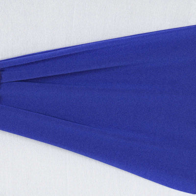 Purple fabric drape on a white background showcasing its texture and flow.