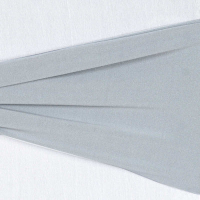 Light gray fabric draped elegantly on a white background.