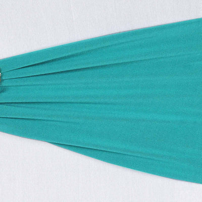 Teal fabric draping elegantly in a studio-style isolation shot