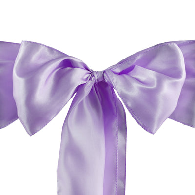 Lavender satin bow with long tails on a white background