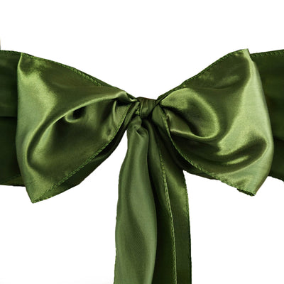 Green satin ribbon bow on a white background.