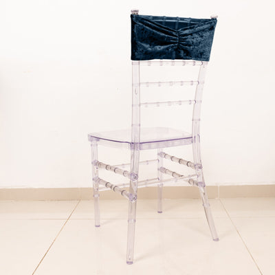 Transparent acrylic chair with a velvet backrest.