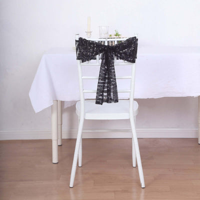 Black lace bow tied on a white chair at a dining table.