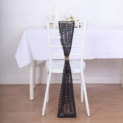 Black lace chair sash draped elegantly on a white chair.