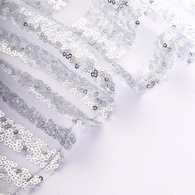 Silver sequin fabric with sheer mesh layered design.