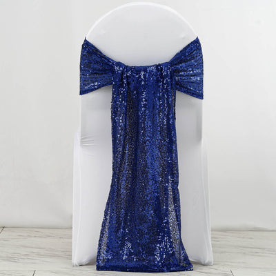 Blue sequin chair sash draped elegantly over a white chair.