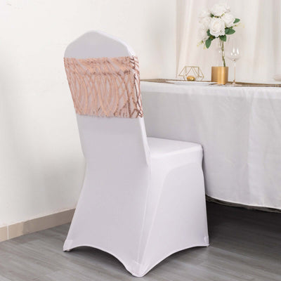 Elegant white chair cover with blush lace accent for event decoration.
