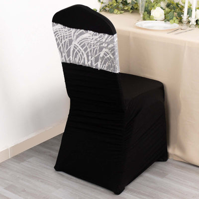 Elegant black chair cover with silver lace detail, perfect for events.