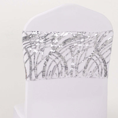 White chair cover with silver sequin design on the back.