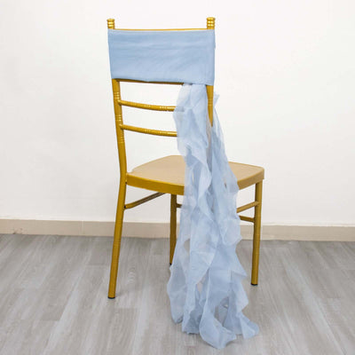 Blue ruffled chair sash draped over a golden chair against a plain background.