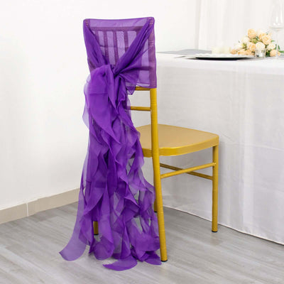 Purple chair sash draped elegantly on a gold chair at a decorated table.