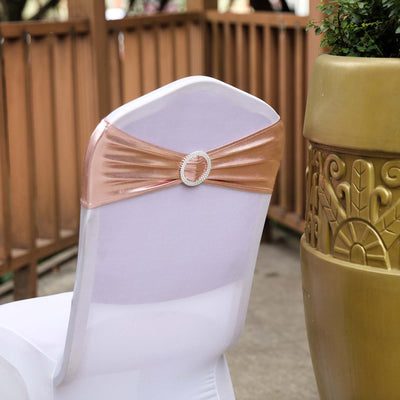 Elegant chair cover with a rose gold sash and embellishment.