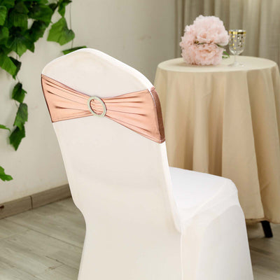 Rose gold chair sash with decorative buckle on a white chair.