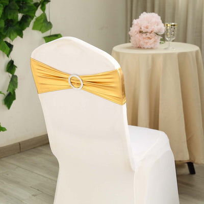 Gold chair sash with rhinestone buckle on a white chair in an elegant setting.
