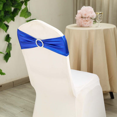 Blue satin chair sash with rhinestone detail on a white chair.