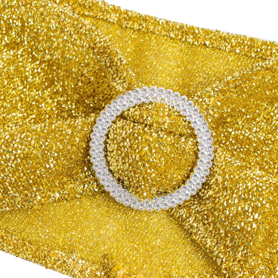 Gold clutch bag with a silver circular embellishment